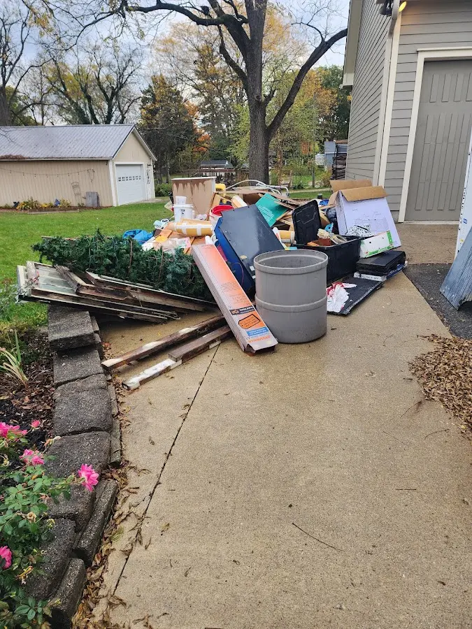 Dumpster being loaded with debris for Residential Dumpster Rental in Southbridge Town